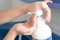 Kid's hand pumping liquid soap Royalty Free Stock Photo