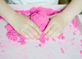 Kid`s hands with kinesthetic sand Royalty Free Stock Photo