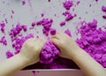 Kid`s hands with kinesthetic sand Royalty Free Stock Photo