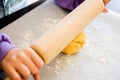 Kid's Hands Rolling Shortcrust Dough closeup