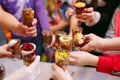 Kid`s party. Children holding cupcakes in the glasses. Royalty Free Stock Photo