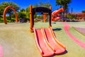 Kid`s Modern Orange Plastic Slide & Playground Equipment At Public Park Royalty Free Stock Photo