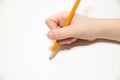 Kid's rigth hand holding a pencil on over white