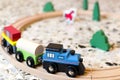 Kid's wooden train on tracks Royalty Free Stock Photo