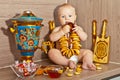 The kid with a samovar and sushka Royalty Free Stock Photo