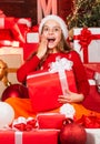 Kid in santa hat with many gift boxes. successful shopping on xmas market. decorated with gifts. shopping packages Royalty Free Stock Photo