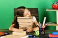 Kid and school supplies on green wall background Royalty Free Stock Photo