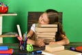 Kid and school supplies on green wall background Royalty Free Stock Photo