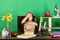 Kid and school supplies on green wall background Royalty Free Stock Photo