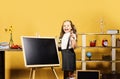 Kid and school supplies on yellow background Royalty Free Stock Photo