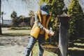 Kid schoolboy in casual clothing washing his hands in the street old fashioned drinking water fountain. Boy in blue Royalty Free Stock Photo