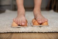 Kid science experiments at home. Close-up child walking on eggs. Strong concept Royalty Free Stock Photo