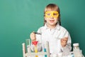 Kid scientist making experiments in home or school laboratory. Child and science education concept Royalty Free Stock Photo