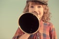 Kid shouting through megaphone Royalty Free Stock Photo