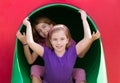 Kid sister girls playing in the park playground Royalty Free Stock Photo