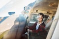 Kid sitting in small aircraft cabin, playing with control wheel