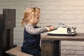 Kid or small boy or businessman child with typewriter