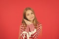 Kid small girl hold hands at cheek gesture of sleep. Good night have nice sleep. Cute peaceful girl on red background