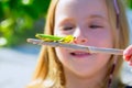 Kid small girl looking praying mantis Royalty Free Stock Photo