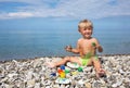 Kid soiled by paints on beach