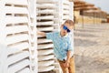 Kid standing near the White Plastic Folding Sun Loungers on the