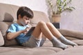 Kid stays home for reading and preparing home task. Stay at home for safety. Reading online