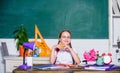 Kid student in school. Girl small child eating apple snack. School break. Relax between lessons. Vitamin charge. School Royalty Free Stock Photo