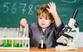 Kid study biology and chemistry in school. School education. Explore biological molecules. Toddler genius baby. Boy near