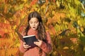 Kid study with book. Autumn literature concept. Keep studying. Small girl read book on autumn day. Small child enjoy