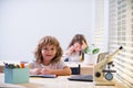 Kid studying at school. Schoolchild doing homework at classroom. Education for kids. Royalty Free Stock Photo