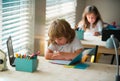 Kid studying at school. Schoolchild doing homework at classroom. Education for kids. Royalty Free Stock Photo