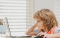 Kid studying at school. Schoolchild doing homework at classroom. Education for kids. Royalty Free Stock Photo