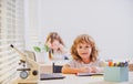 Kid studying at school. Schoolchild doing homework at classroom. Education for kids. Royalty Free Stock Photo