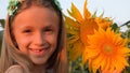 Kid in Sunflower Field at Sunset, Child Playing and Laughing in Agriculture Crop, Girl Portrait Smiling Outdoor in Nature, Happy C Royalty Free Stock Photo