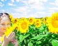 Kid and sunflowers Royalty Free Stock Photo