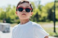 Kid in sunglasses looking at camera Royalty Free Stock Photo