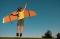 Kid superhero jump anf fly with jetpack. Child pilot play on summer day. Success, leader and winner concept. Imagination