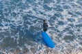 Kid with blue surfing board