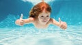 Kid swim underwater in pool. Child boy swimming under water with thumbs up. Banner for header, copy space. Poster for Royalty Free Stock Photo