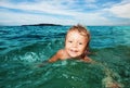 Kid swimming in the sea Royalty Free Stock Photo