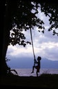 Kid on Swing Borneo Coast Royalty Free Stock Photo