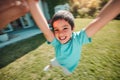 Kid, swing and pov with a boy spinning outdoor in the garden of his home with a parent closeup. Children, portrait and