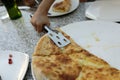 Kid takes Megrelian Khachapuri from plate