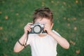 Kid taking a picture using film camera Royalty Free Stock Photo