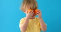 Kid with tangerines. small boy with mandarins