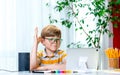 Kid and technology. Boy in shirt is reading tablet computer. Modern education and school technology concept with laptop Royalty Free Stock Photo