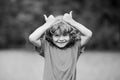 Kid thumbs-up. Child boy approves. Portrait of smiling little boy showing thumbs up.