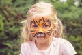 Kid with tiger face painting Royalty Free Stock Photo