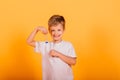 Kid time concept - serious male preschooler enjoying learning about time, holding an hour glass, studio shot Royalty Free Stock Photo