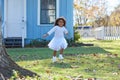 Kid toddler girl white dress running in park Royalty Free Stock Photo